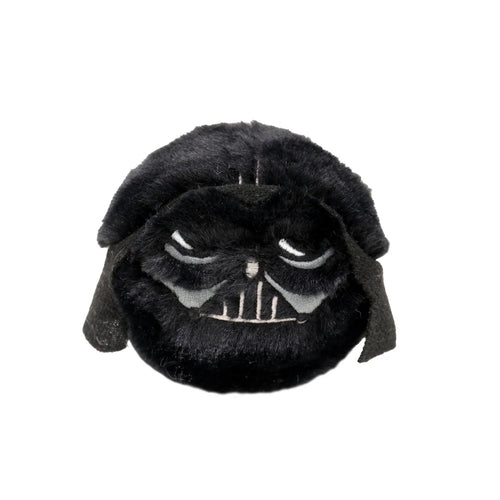 Plush toy resembling a character with a dark helmet on a white background