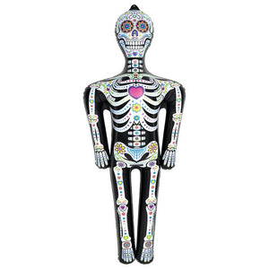 Decorative skeleton figure with colorful designs on a white background