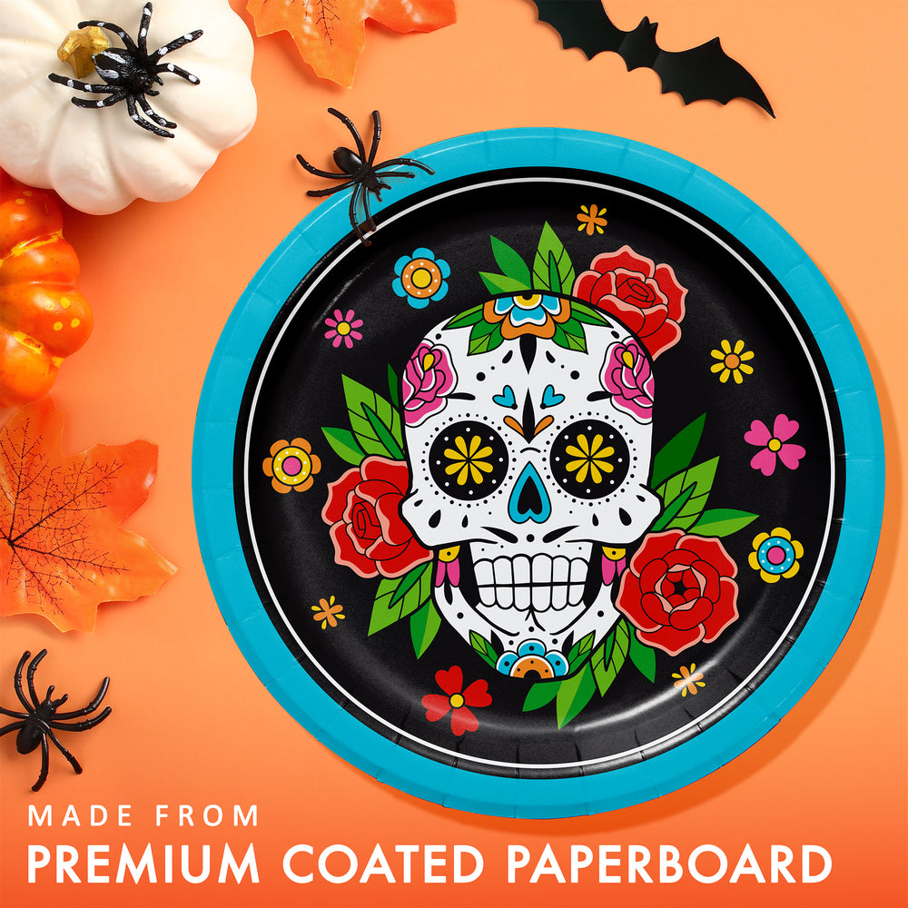 Halloween-themed paper plate with colorful skull design on an orange background with pumpkins and bats.