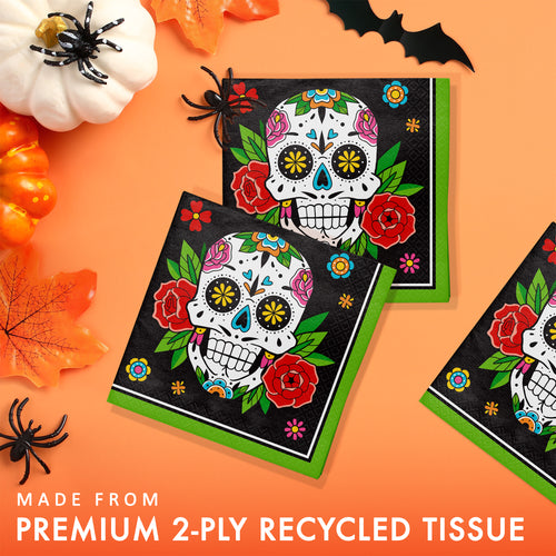 Halloween-themed tissue paper with sugar skull design on an orange background.