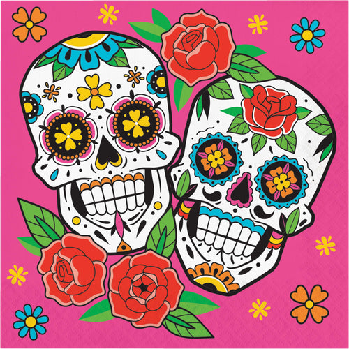 Colorful sugar skull design with flowers on a pink background
