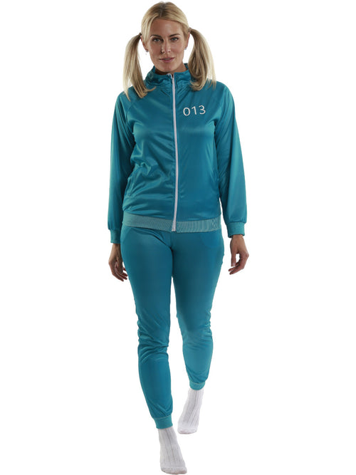 Woman wearing a teal tracksuit with the number 013 on a white background