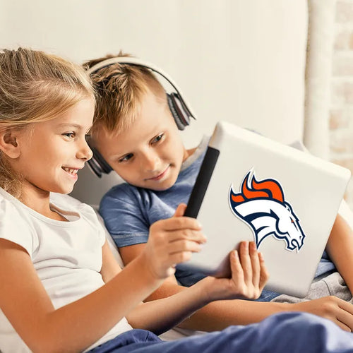 Two children using a tablet with a Denver Broncos logo on a light background