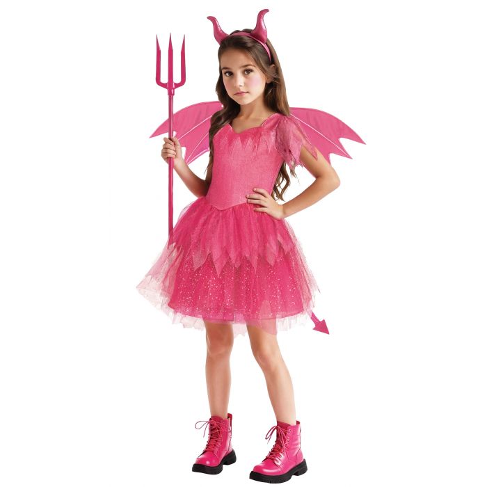 A young girl modeling a pink devil costume consisting of a sparkly tulle dress, matching horn headband, wings, and a tail, while holding a pink toy pitchfork against a plain white background.