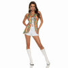 Woman wearing a colorful sleeveless top with floral pattern, white shorts, and white boots on a white background