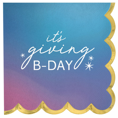 Napkin with 'it's giving B-DAY' text on a gradient blue and pink background with gold trim.