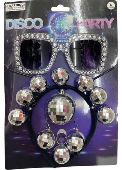 Packaged disco party accessory set with sunglasses, necklace, and earrings on a purple background.