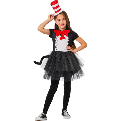 Child wearing a black and white costume with a red and white hat on a white background