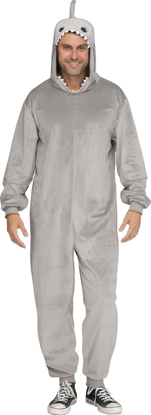 A man wearing a light gray plush shark onesie with a hood featuring a shark face and small fins, standing against a plain white background.