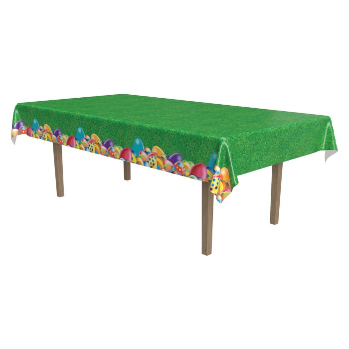 Green tablecloth with colorful Easter egg design on a white background