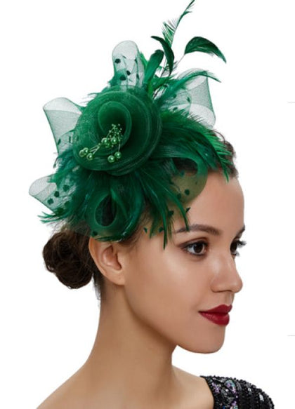 Woman wearing a green feathered headpiece on a white background