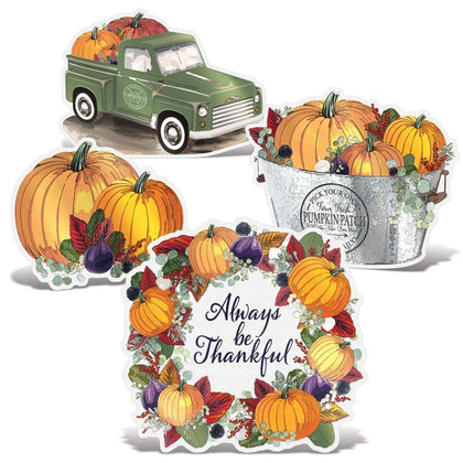 Autumn-themed decorations including a green truck, pumpkins, and a 'Always be Thankful' sign.