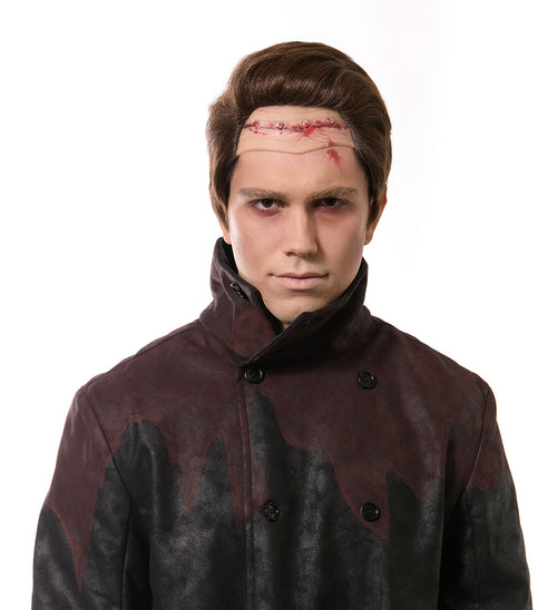 Person wearing a dark coat with bloodstains on a white background