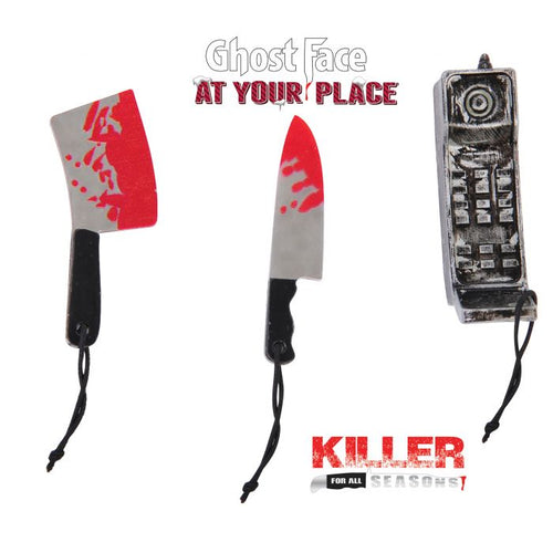 Three Halloween costume prop weapons on a white background: a bloody cleaver, a bloody knife, and a gray cell phone. Text above reads 'Ghost Face AT YOUR PLACE' and below the products reads 'KILLER FOR ALL SEASONS 1'.