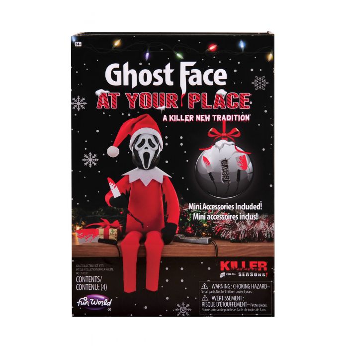 Front of the Ghost Face 'At Your Place' retail box from Fun World, showing the packaged horror elf figure and accessories on a black holiday-themed background.