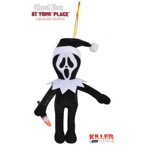 A Ghost Face plush ornament from the movie 'At Your Place' wearing a Santa hat and holding a knife, on a white background with movie text overlays.