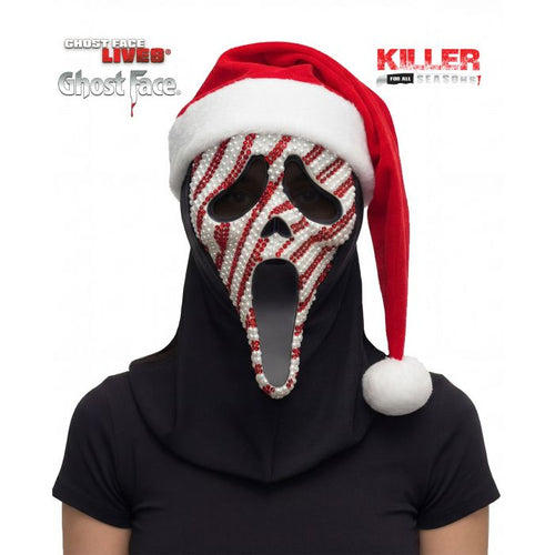 A person wearing a Ghostface-themed Santa hat mask with red and white candy cane stripes, a red Santa hat, and a black neck gaiter over a black t-shirt, on a white background with 'Chucky Lives' and 'Killer Ghost Face' logos.