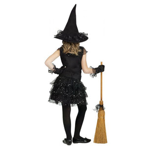 Child wearing a black witch costume with a hat and broom on a white background
