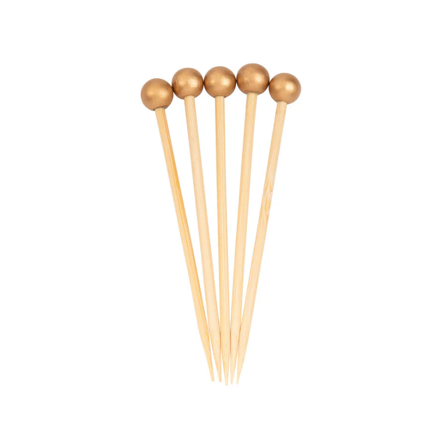 Set of wooden skewers with round wooden beads on a white background