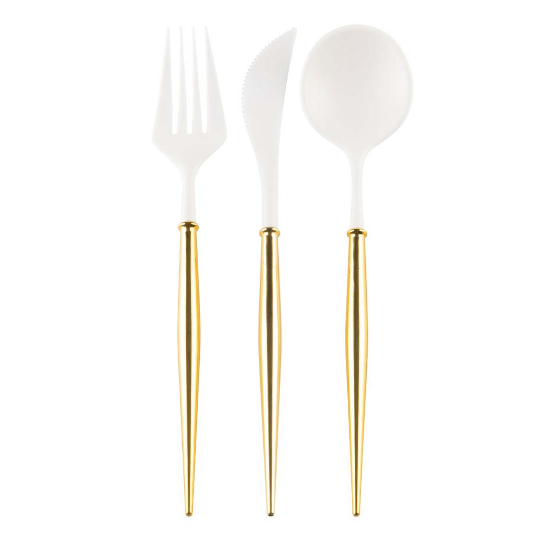 Set of white cutlery with gold handles on a white background