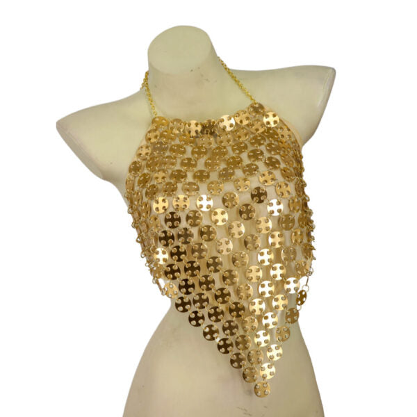 Gold sequin top on a mannequin against a white background