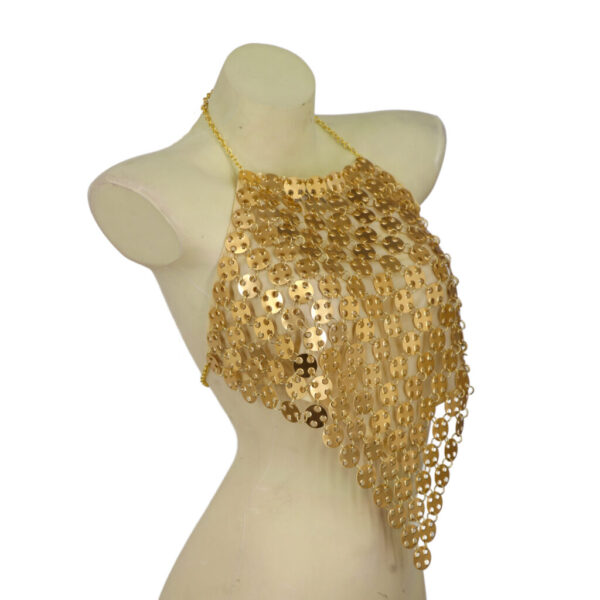 Gold sequin top on a mannequin against a white background