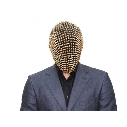 Person wearing a spiky gold helmet and gray suit on a white background