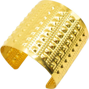Gold cuff bracelet with textured design on a white background