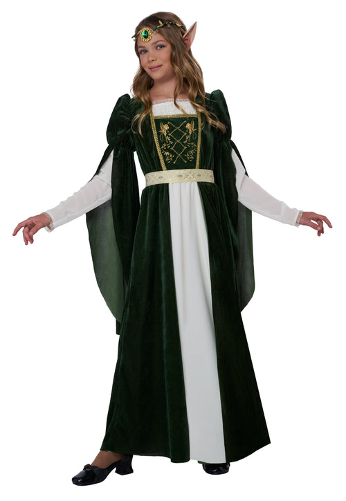 A woman modeling a dark green and white elf princess costume with gold embroidery, a matching headband with a green gem, and black shoes, set against a plain white background.