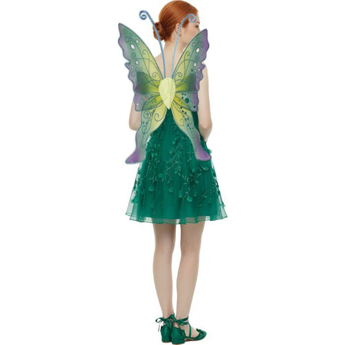 A child model shown from the back wearing a green fairy costume with large translucent butterfly wings in green, yellow, and purple, plus green lace-up shoes, on a plain white background.