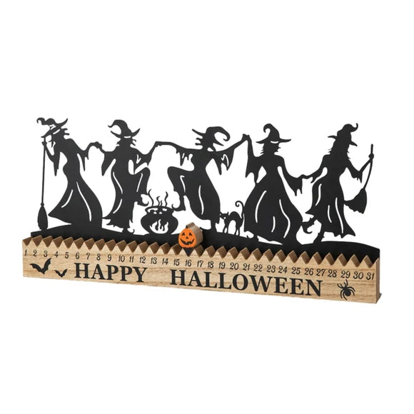 A Halloween-themed wooden tabletop calendar featuring five black witch silhouettes, a small jack-o'-lantern, a cat silhouette, and a numbered days-remaining display from 1 to 31, with 'HAPPY HALLOWEEN' printed on the front.