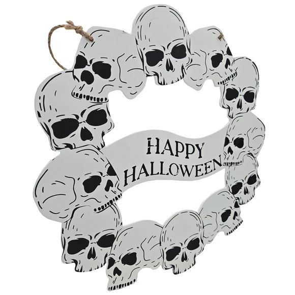 A circular Halloween wreath made of stacked skull cutouts with a hanging loop at the top and a banner reading 'Happy Halloween' in black text on a white background.