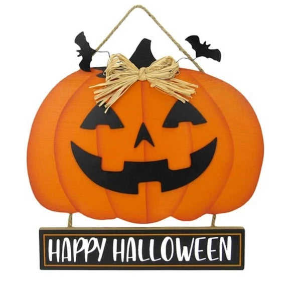 Orange jack-o'-lantern Halloween wall hanging with a black carved face, straw bow, small black bats, and a hanging sign that reads “HAPPY HALLOWEEN.”.