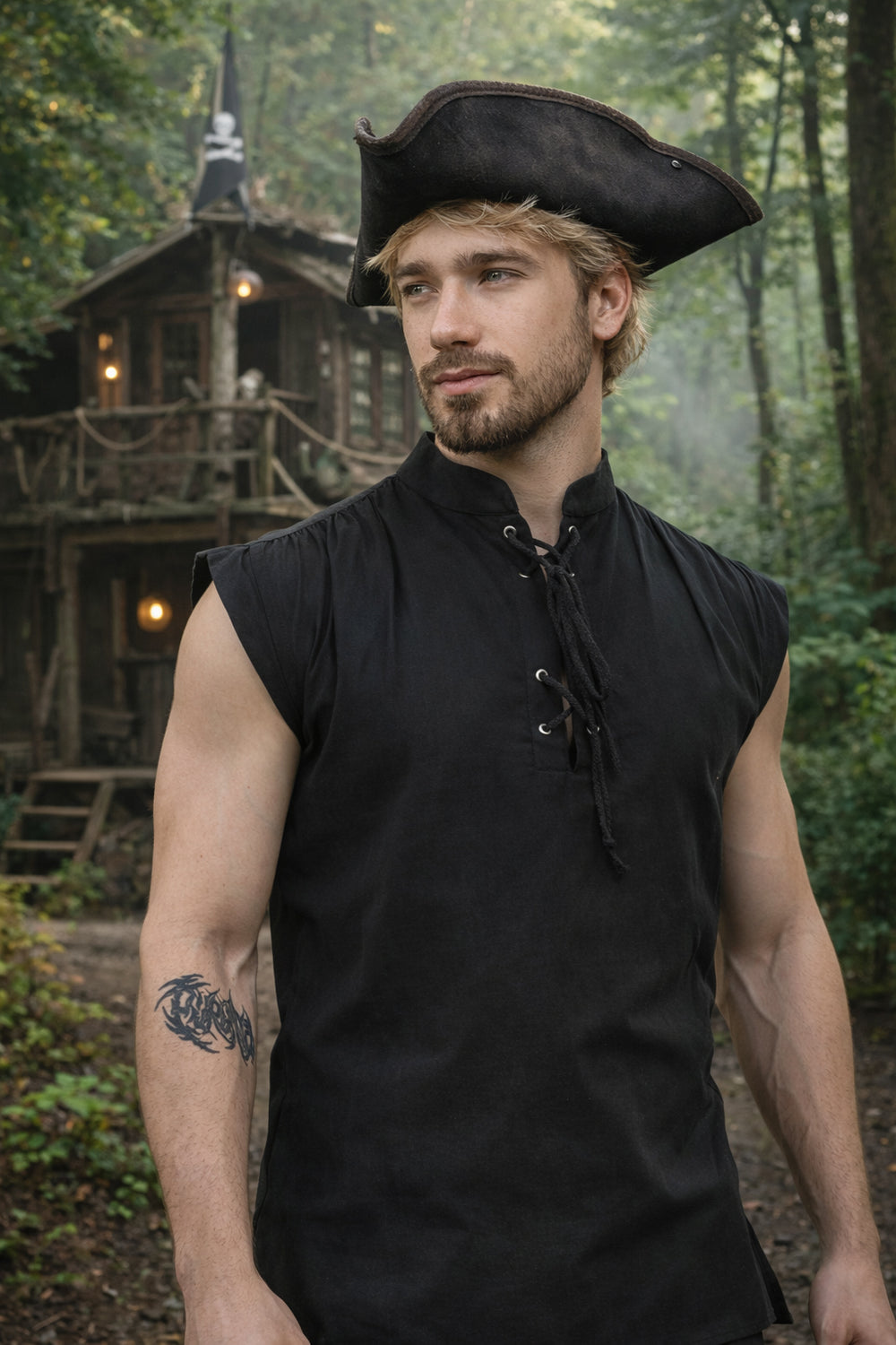 Man wearing a black sleeveless shirt and tricorn hat in a forest setting with a treehouse.