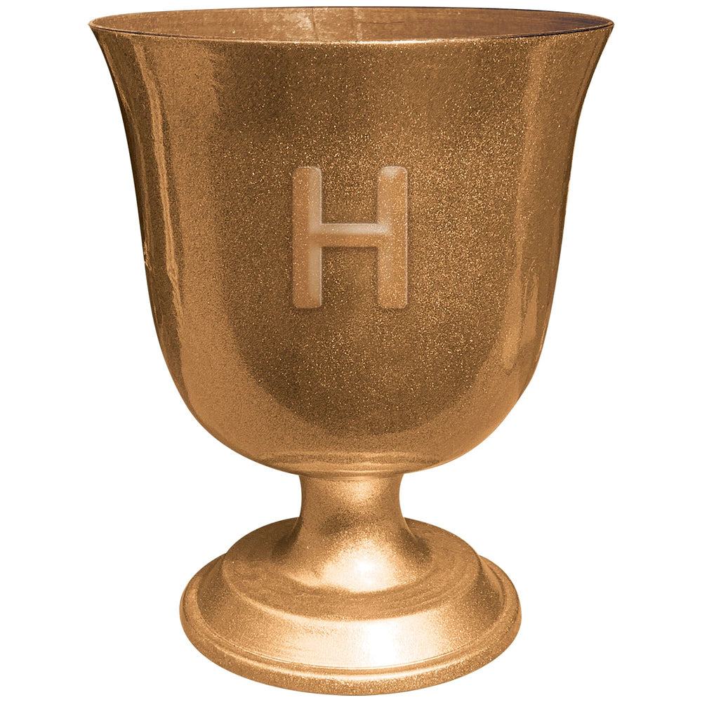 Bronze-colored urn with a letter 'H' on a white background