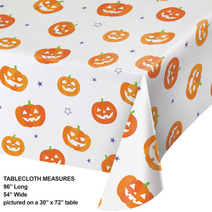 Halloween-themed tablecloth with jack-o'-lanterns on a white background