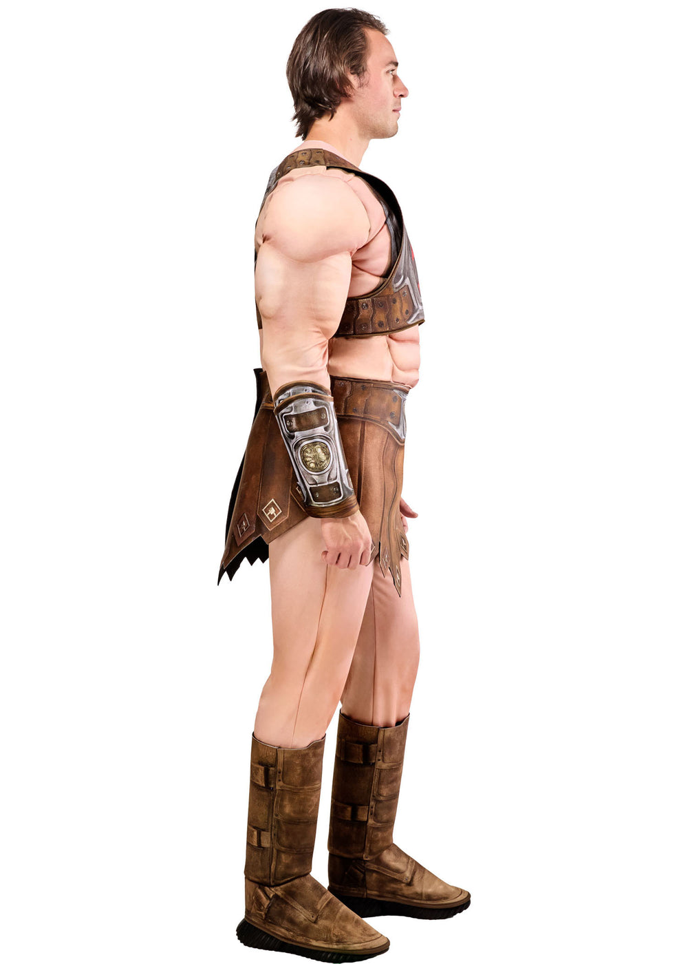 Man wearing a detailed warrior costume with armor and boots on a white background