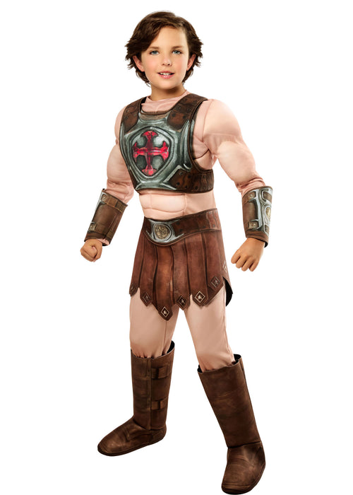 Child wearing a costume with armor and boots on a white background