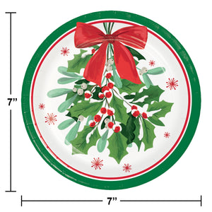 Round paper plate with holly design, red bow, and measurements on a white background