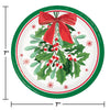 Round paper plate with holly design, red bow, and measurements on a white background