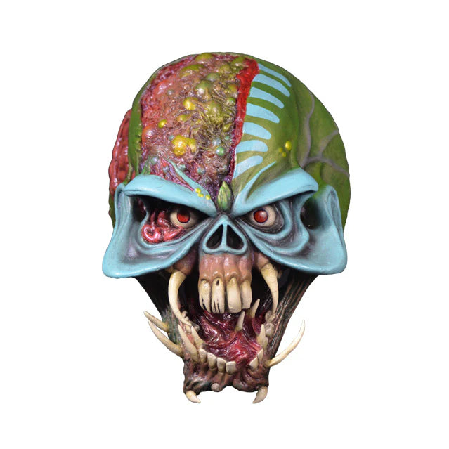Glossy alien mask with detailed design on a white background
