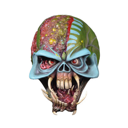 Glossy alien mask with detailed design on a white background