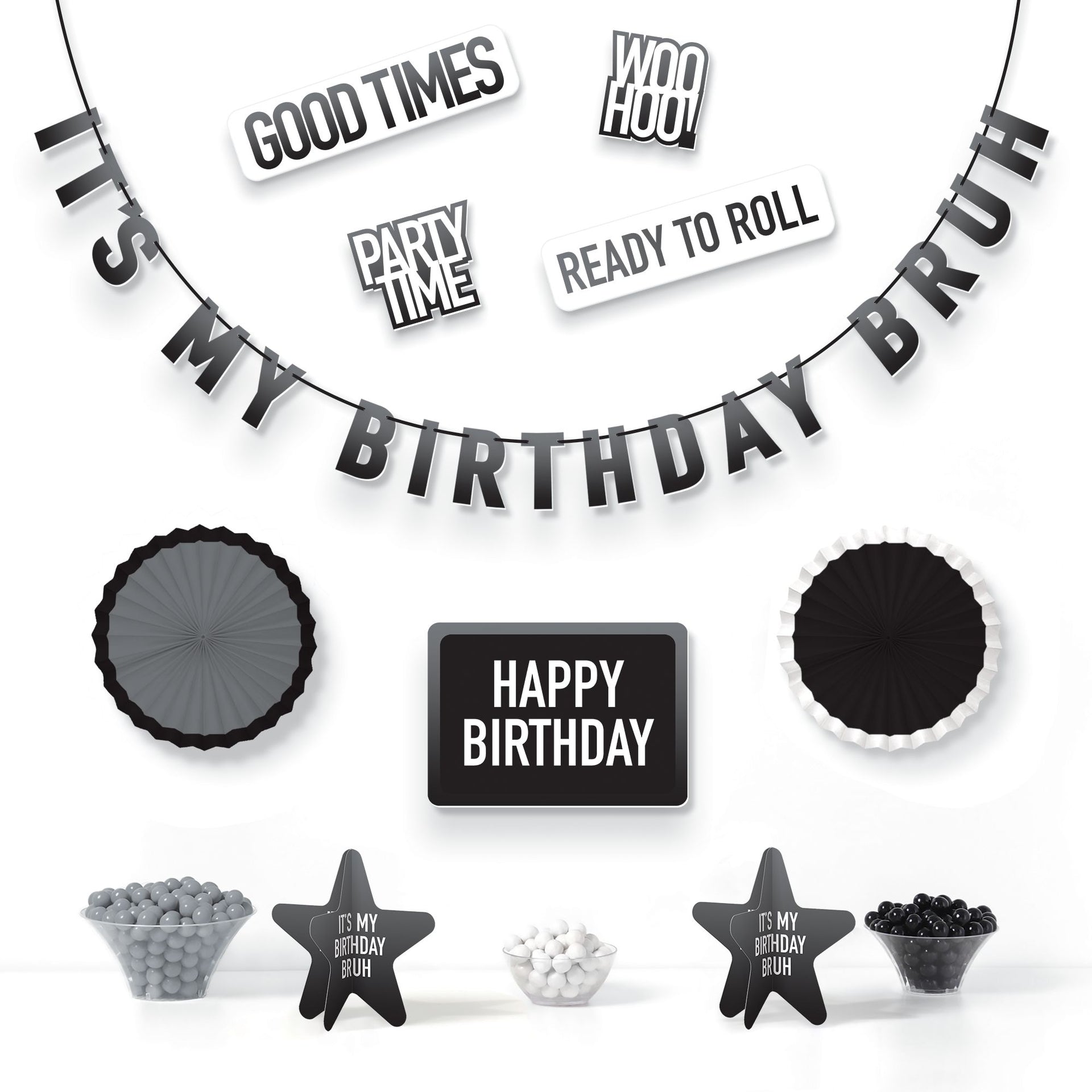 Black and white birthday party decorations with text and small items on a white background