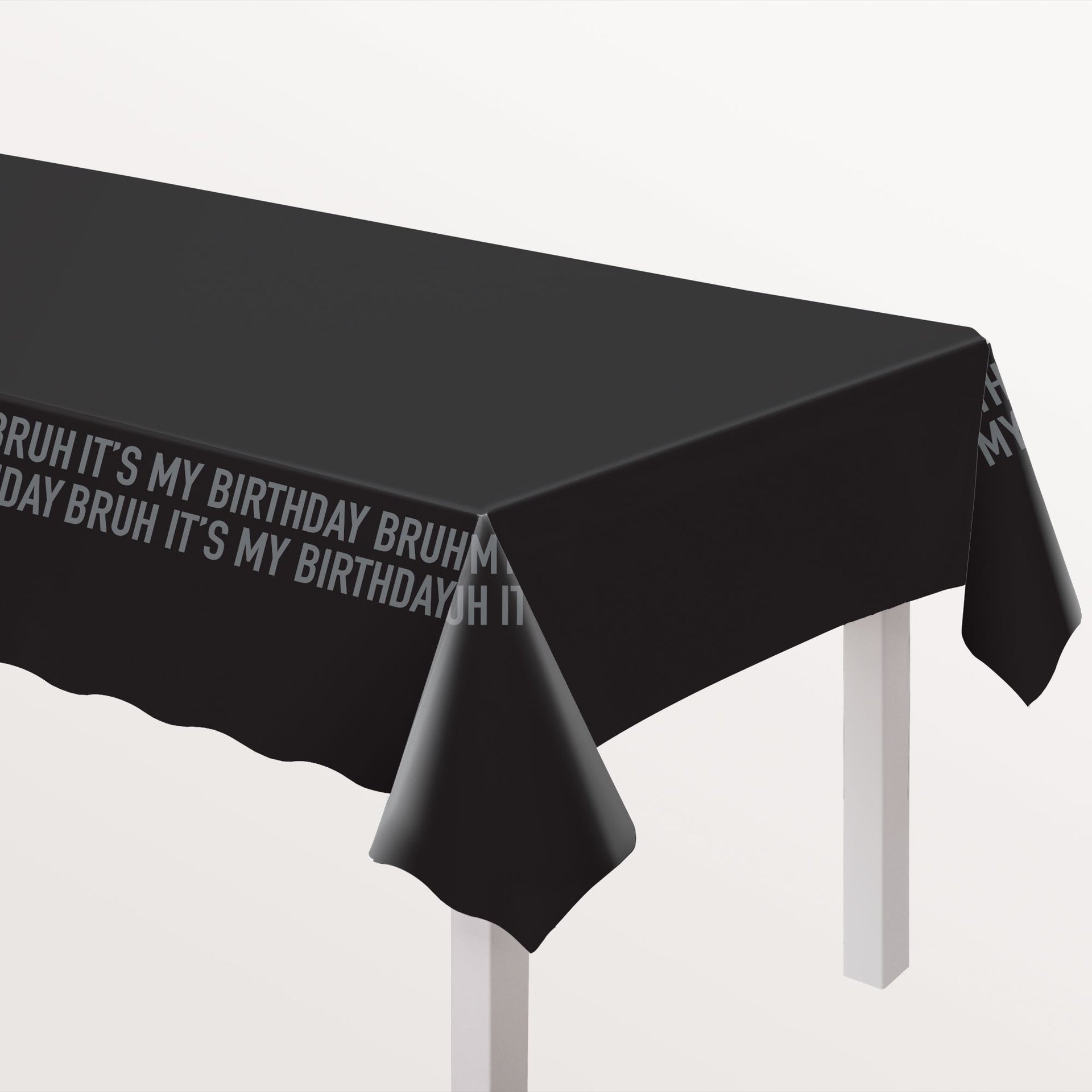 Black tablecloth with text 'BRUH IT'S MY BIRTHDAY BRUH' on a white background