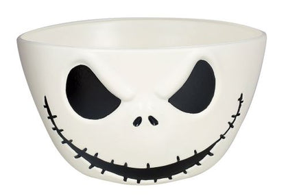 White bowl with a black face design on a white background