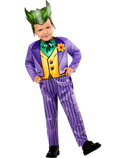 Child wearing a colorful costume with a purple suit and green headpiece on a white background