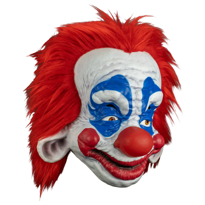 Clown mask with red hair, white face, and blue accents on a white background