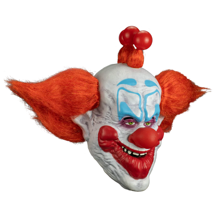 Clown mask with red hair and white face with blue accents on a white background