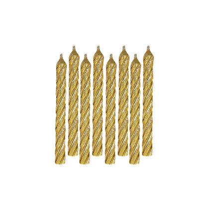 Set of gold twisted candles on a white background