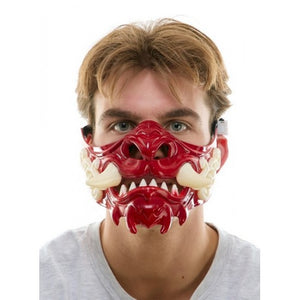 Person wearing a red and white mask with a fierce design on a white background